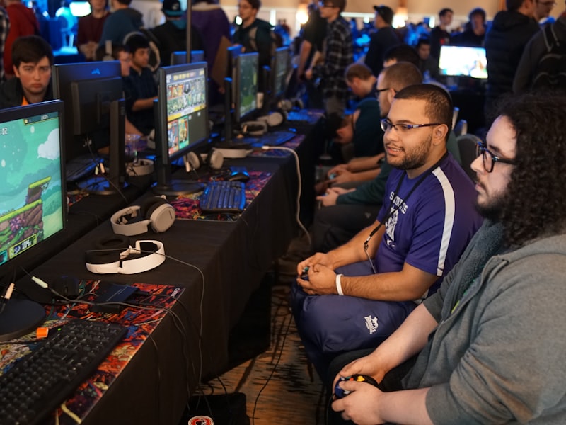 The main gaming floor at TapGameFlow with rows of lit gaming stations